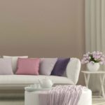 sunny living room with flowers and sofa