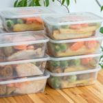 Meal prep. Stack of home cooked roast chicken dinners in containers ready to be frozen for later use.