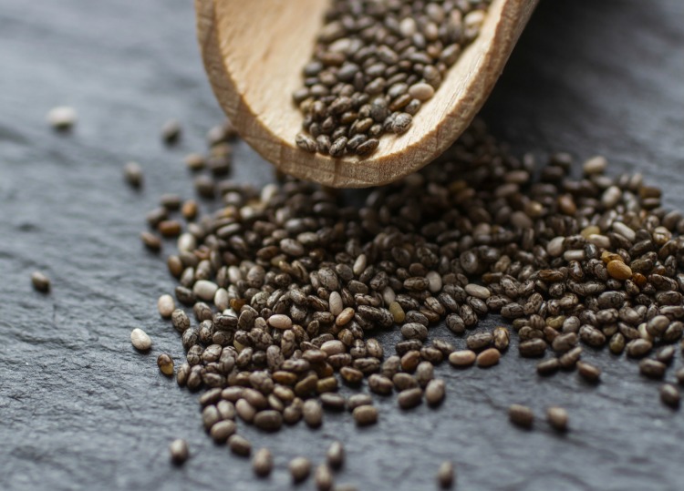 chia seeds on a wooden scoop
