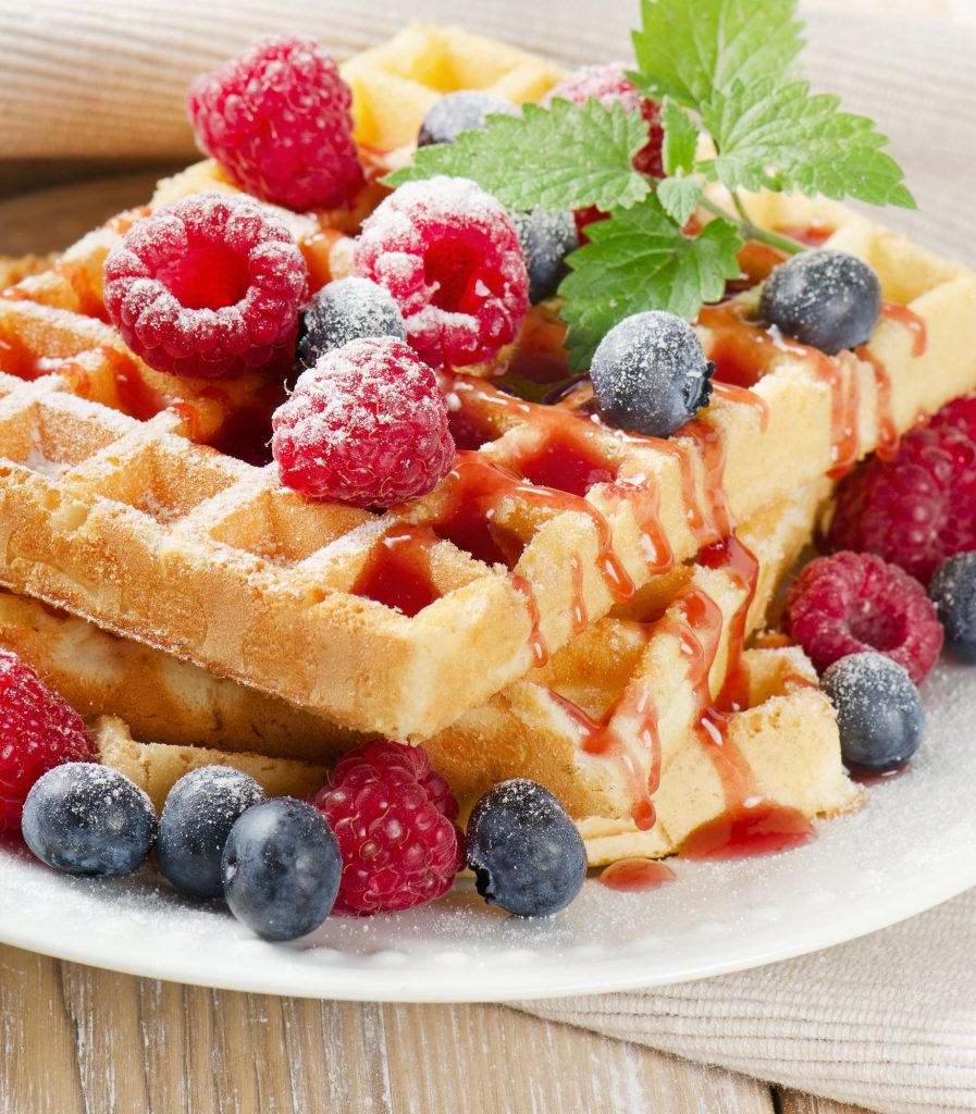 waffles with blueberries and raspberries. Selective focus